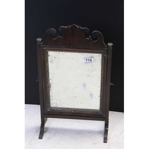 719 - George III Mahogany Swing Mirror, 47cms high together with Three Legged Stool with Carved Top