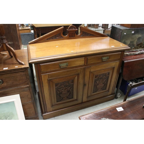 721 - Victorian Mahogany Sideboard with two drawers and two cupboard doors, the doors with panels carved w... 