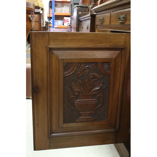 721 - Victorian Mahogany Sideboard with two drawers and two cupboard doors, the doors with panels carved w... 