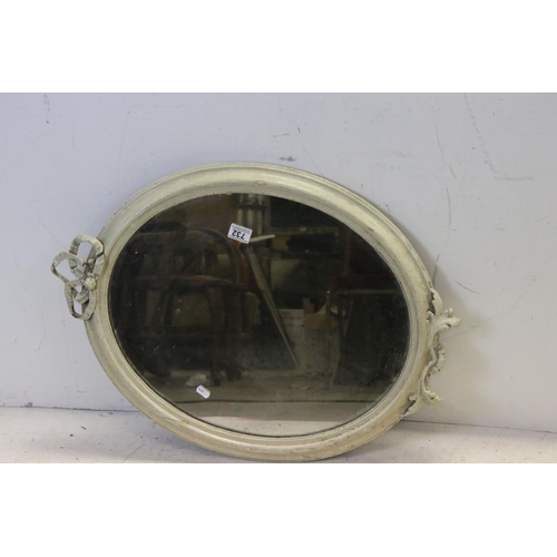 732 - 19th century Oval Mirror in a later painted Gilt Frame, 74cms high