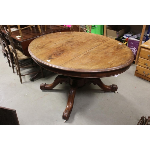 734 - Victorian Walnut Tilt Top Oval Loo Table raised on a large bulbous support with four splayed legs an... 