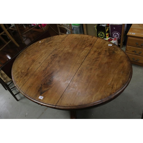 734 - Victorian Walnut Tilt Top Oval Loo Table raised on a large bulbous support with four splayed legs an... 