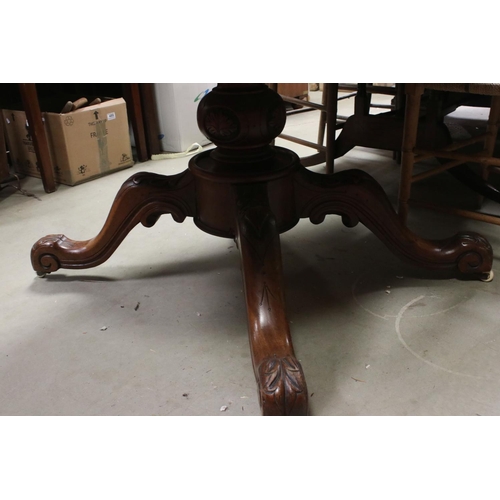 734 - Victorian Walnut Tilt Top Oval Loo Table raised on a large bulbous support with four splayed legs an... 