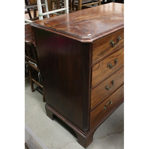 739 - George III Mahogany Chest of Four Long Drawers, with canted fluted corners and raised on bracket fee... 