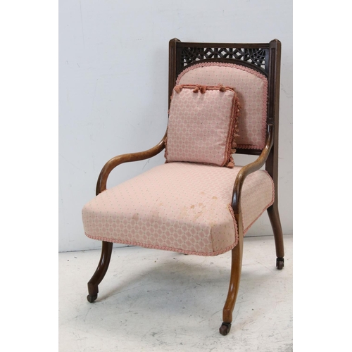 760 - 19th century Mahogany Nursing Chair, with pierced carved back, curved arms and legs, and upholstered... 