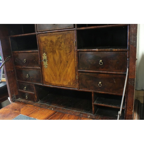 766 - 18th century Walnut Escritoire, the hinged fall front enclosing a fitted interior, over two short an... 