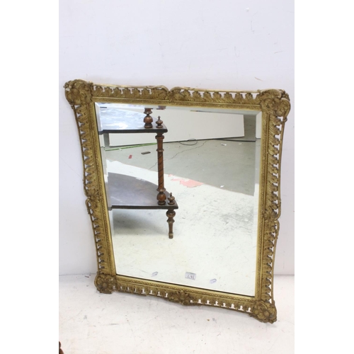 767 - Gilt gesso rectangular wall mirror with bevelled plate, 82cms x 68cms together with Walnut corner wh... 