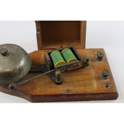 49 - A vintage wooden cased bell.