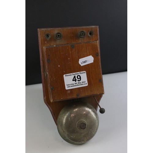 49 - A vintage wooden cased bell.