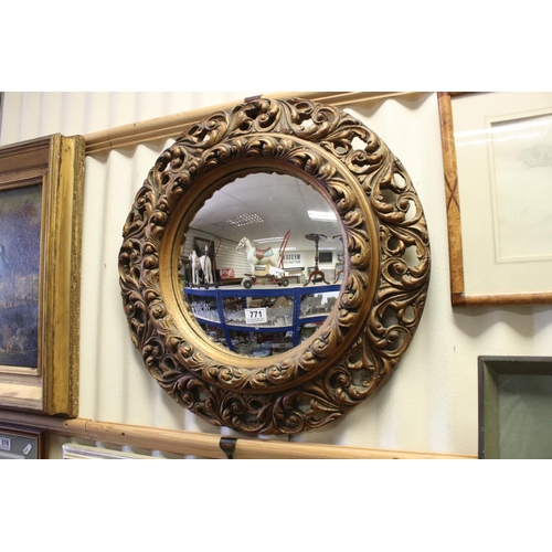 771 - 19th / Early 20th century Circular Mirror in a Gilt Scrolling Pierced Frame, 60cms diameter