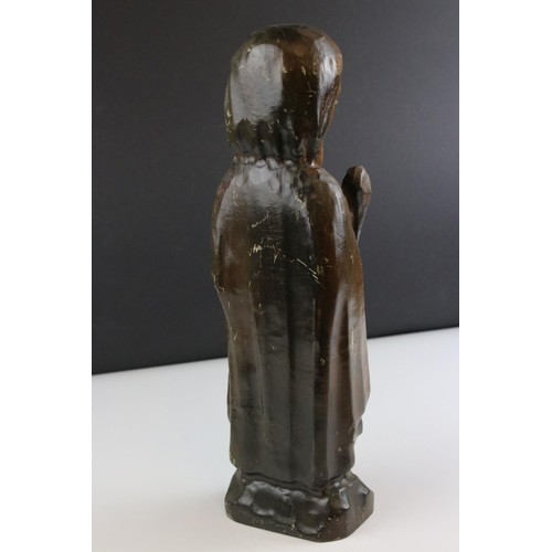 81 - A carved wooden figure of a religious figure.