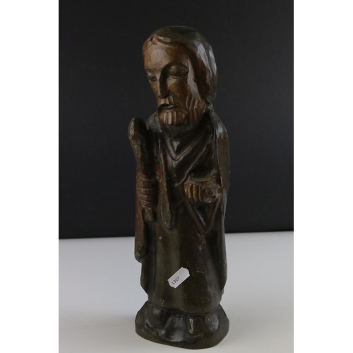 81 - A carved wooden figure of a religious figure.