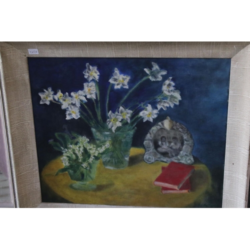 378 - A mid 20th century oil on canvas still life of flowers and one other similar oil on board.