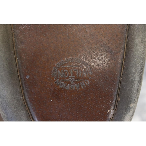 396 - Two brown leather ladies side saddles one marked Wilton champion.