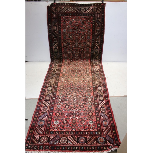 657 - Persian Red Ground Rug, 310cms x 113cms