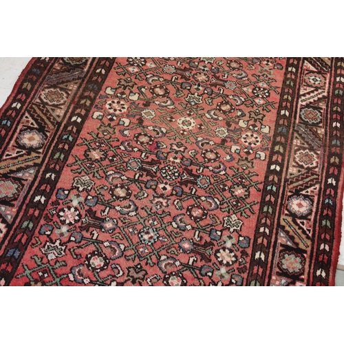 657 - Persian Red Ground Rug, 310cms x 113cms