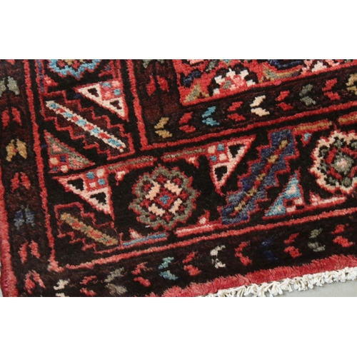 657 - Persian Red Ground Rug, 310cms x 113cms