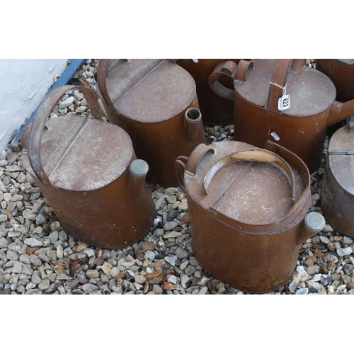 623 - A collection of seven vintage watering cans