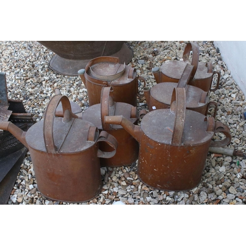 623 - A collection of seven vintage watering cans