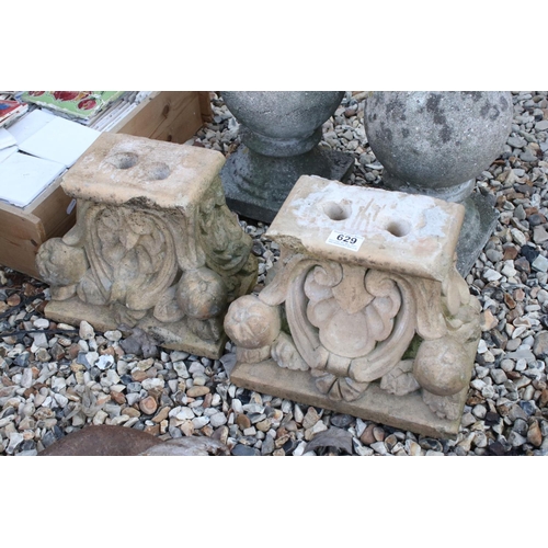 629 - Pair of terracotta corbels, approx. 24cm high