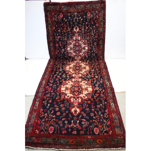 660 - Persian Red Ground Rug, 317cms x 130cms