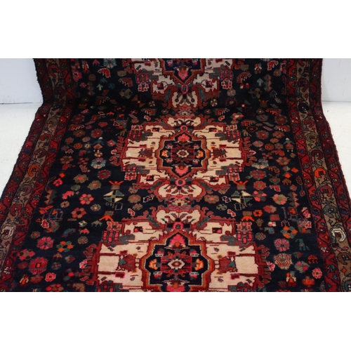 660 - Persian Red Ground Rug, 317cms x 130cms