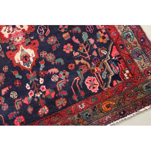 660 - Persian Red Ground Rug, 317cms x 130cms