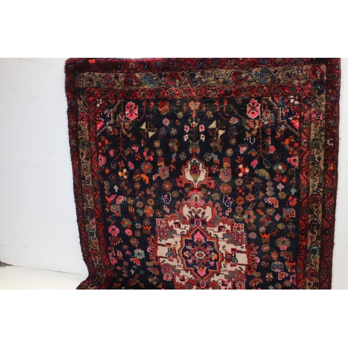 660 - Persian Red Ground Rug, 317cms x 130cms