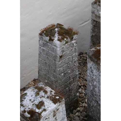 612 - A set of six composite stone driveway pillars.