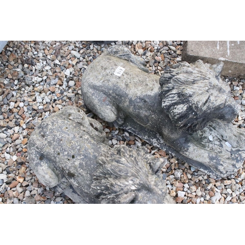 618 - A pair of vintage weathered lion statues, approx 58cm in length