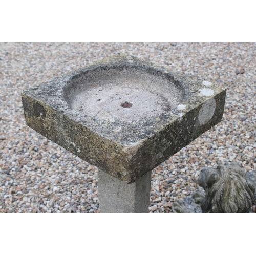 619 - A mid century stone bird bath, stands approx 82cm in height