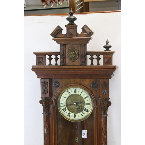 521 - A antique Vienna style drop dial twin train movement wall clock with brass weights.