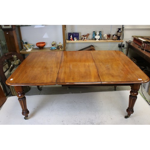 654 - 19th century Mahogany Extending Dining Table, with two additional leaves, raised on turned and flute... 