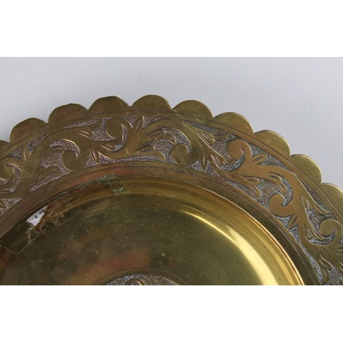 79 - An arts and Crafts early 20th century brass dish with stylized etched decoration to edge dated 1912 ... 