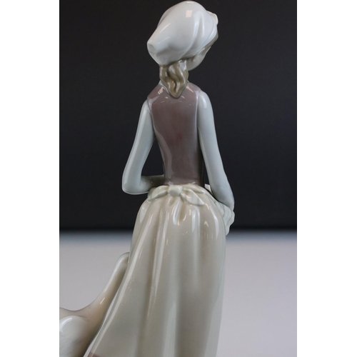 1 - Two Lladro Figurines including Girl with Geese, 31cms high and a Lady with Parasol (a/f)