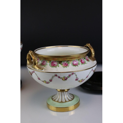 14 - Pair of Early 20th century Cauldon Ltd Twin Handled Urns, decorated with pink roses and with gilt hi... 