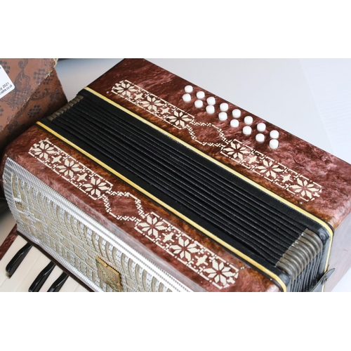 24 - Cased Russian ' Razno Manbiw ' Accordian, 30cms wide