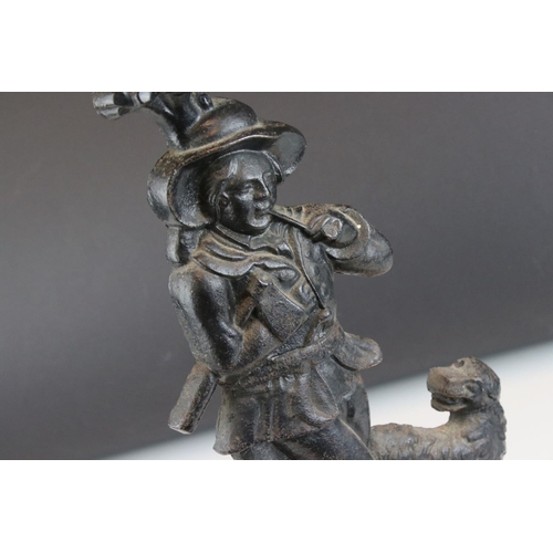 26 - Antique style Cast Iron Doorstop in the form of a Woodsman with Dog, 39cms high