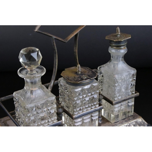 31 - Glassware including a Six Bottle Condiment Set on Silver Plated Stand, unusual Decanter with screw o... 