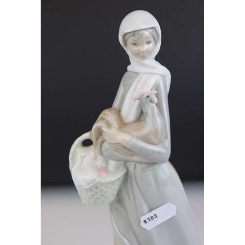 7 - Two Lladro Figurines - Girl holding Lamb, 29cms high and Girl holding Chicken and Basket (a/f), 25cm... 