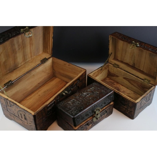 78 - A set of three oriental carved wooden graduated boxes.