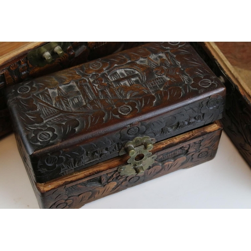 78 - A set of three oriental carved wooden graduated boxes.