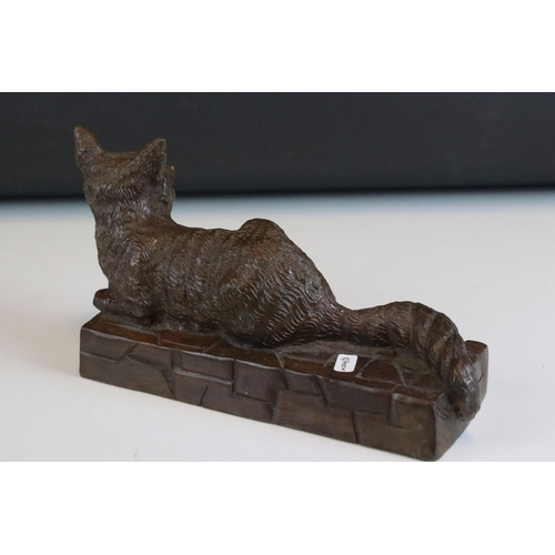 90 - Solid bronze recumbent fox on wall effect plinth