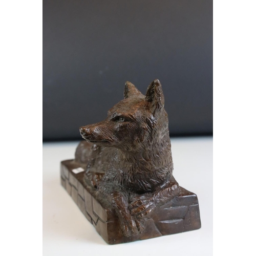 90 - Solid bronze recumbent fox on wall effect plinth