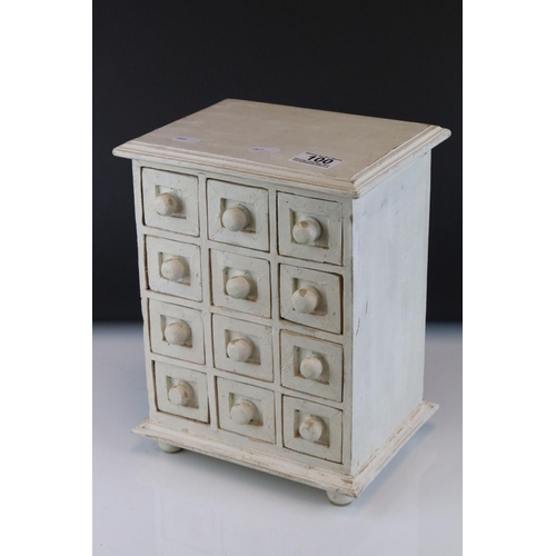 100 - A white tabletop chest of twelve drawers, stands approx 29cm in height.