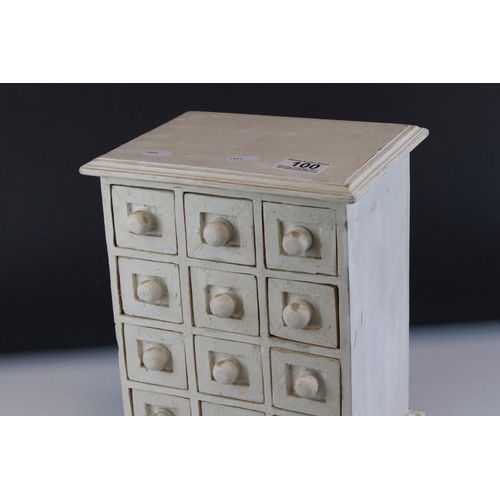 100 - A white tabletop chest of twelve drawers, stands approx 29cm in height.