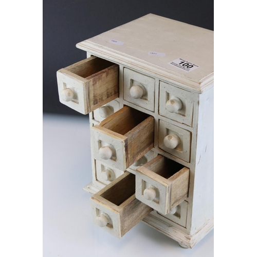 100 - A white tabletop chest of twelve drawers, stands approx 29cm in height.