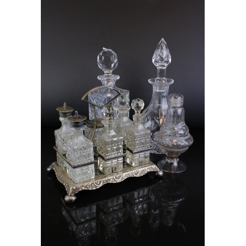 31 - Glassware including a Six Bottle Condiment Set on Silver Plated Stand, unusual Decanter with screw o... 