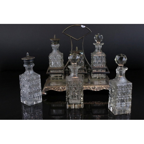 31 - Glassware including a Six Bottle Condiment Set on Silver Plated Stand, unusual Decanter with screw o... 