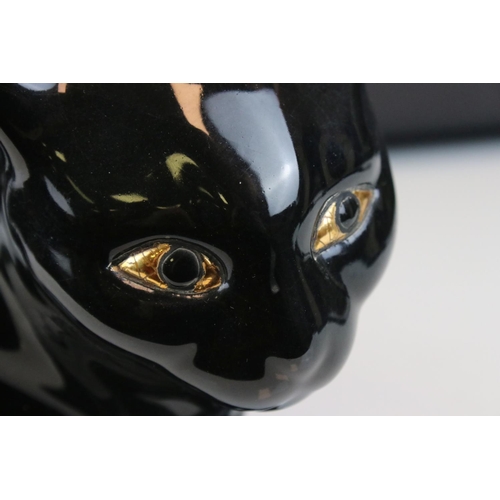 5 - French Emaux de Longwy Pottery Black Cat, stamped to base ' Faienceries de Longwy ', 24cms long